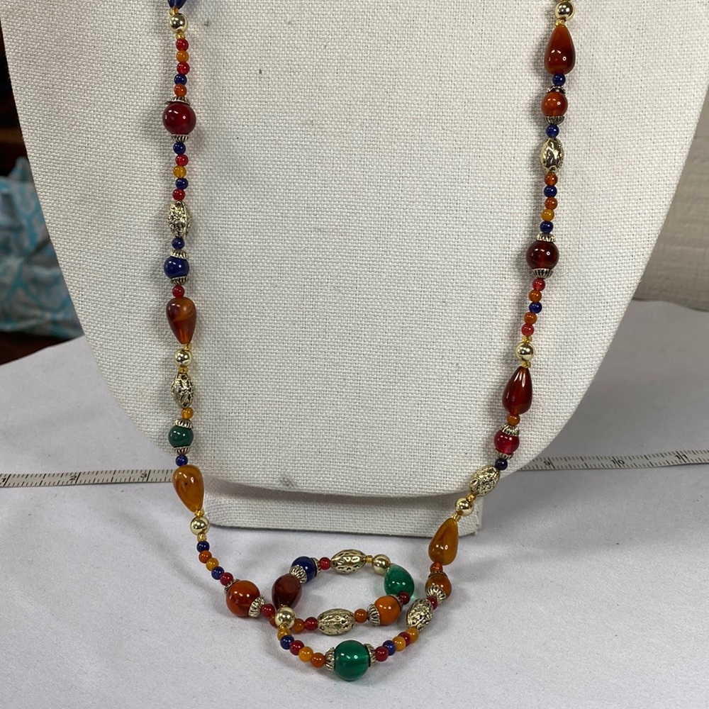Long older style multi colored bead necklace